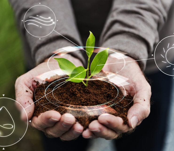 Smart agriculture IoT with hand planting tree background